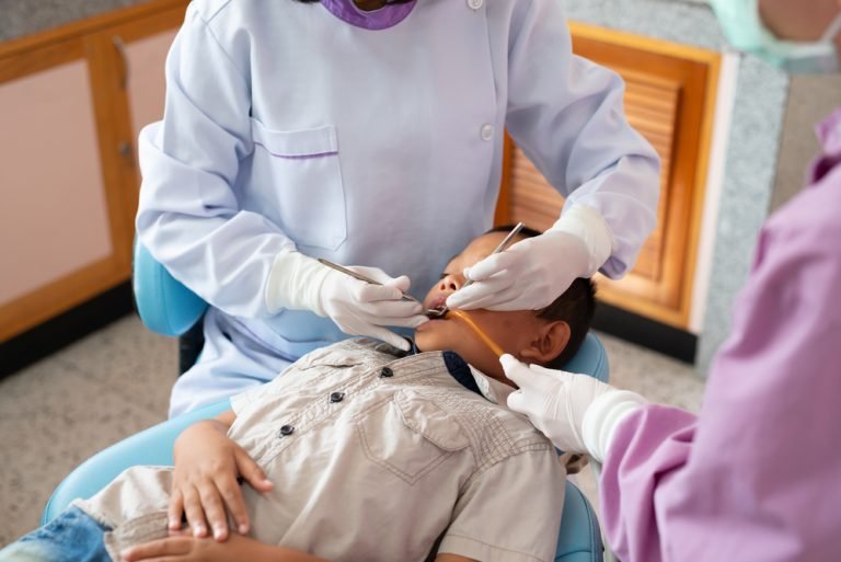 close-up-of-asian-boys-lying-on-a-dental-chair-wi-2025-10-17-02-03-59-utc (1)