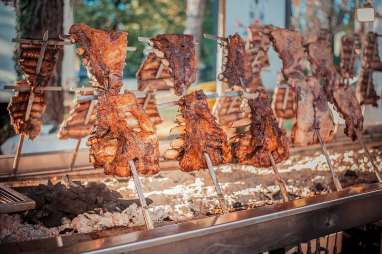 Traditional Argentinian asado roasted lamb grilled meat.