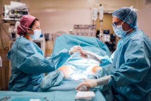 Surgeons and nurse during a foot surgery