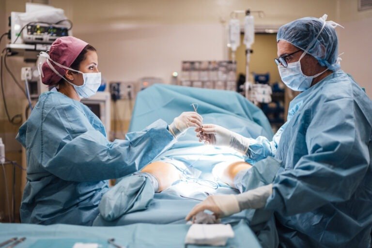 Surgeons and nurse during a foot surgery