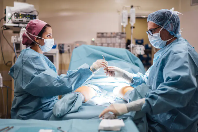 Surgeons and nurse during a foot surgery