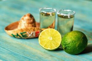 Tequila with lime and salt, selective focus