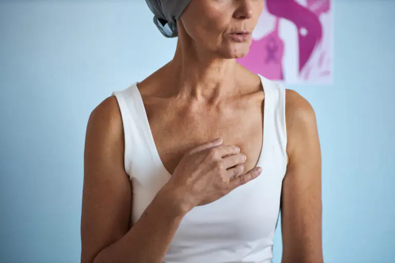 Middle Aged Woman Touching Chest While Undergoing Cancer Treatment